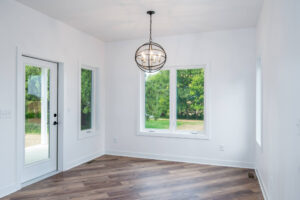 gathering space with decorative light fixture and door to yard
