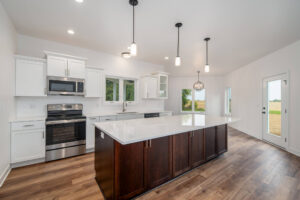 white kitchen with island in center